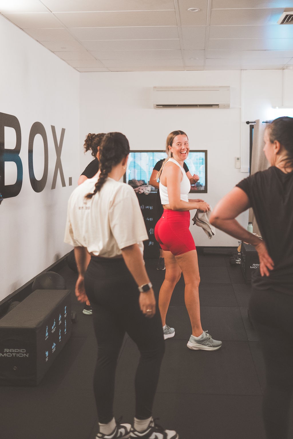 BOX members smiling together between training sets
