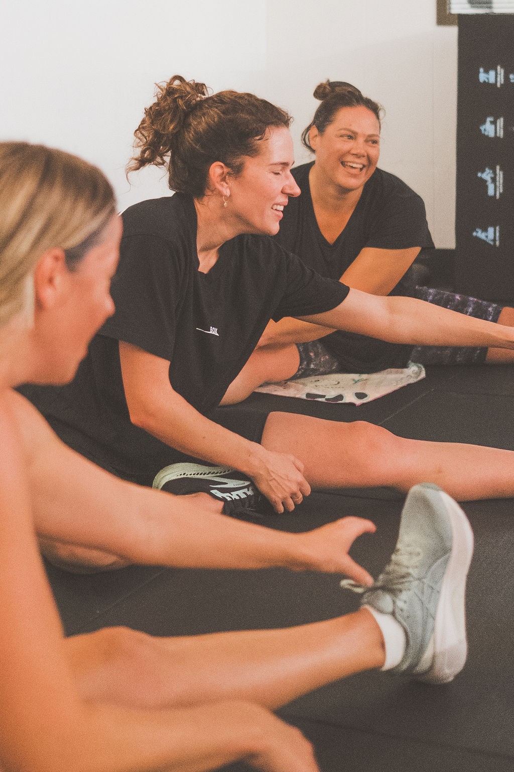 BOX members laughing together after training